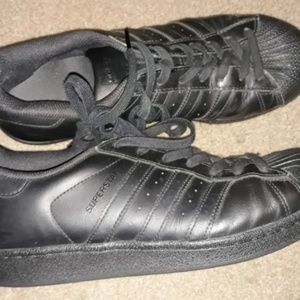 Men's leather tennis shoes by Adidas